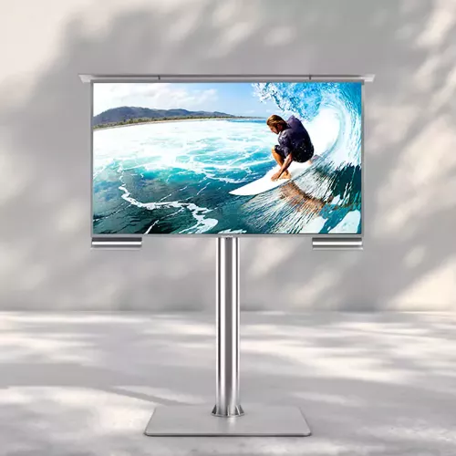 Man surfing on a wave presented on an outdoor TV in a clean space in Sharjah.